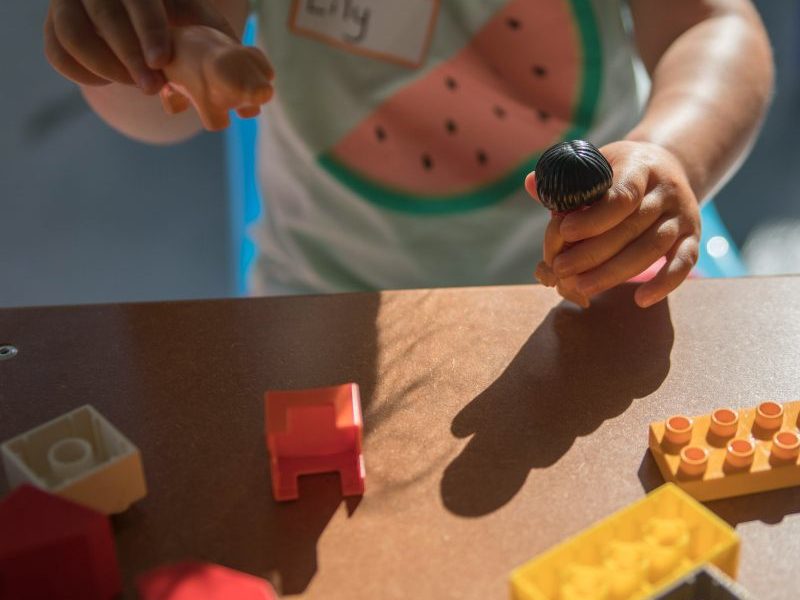child playing with toys